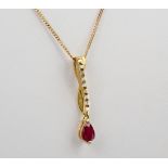 A 9ct yellow gold, ruby and diamond pendant necklace, the pear cut ruby measuring approximately 0.