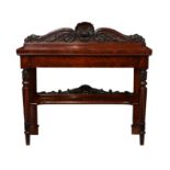 A William IV mahogany two tier buffet, the rectangular top with shell, vine fruit, foliate scroll