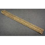 A 9ct yellow gold brick pattern flexible bracelet, hallmarked B. H. Britten, Birm. 1970, 8 1/8in. (