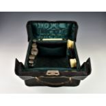 A fine Victorian travelling vanity / gentleman's toilet case, the canvas slip protecting the black