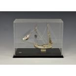 A miniature Continental sterling silver model of a galleon ship, marked 'SILVERO', sitting on