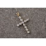 A 9ct gold and cubic zirconia cross, featuring 22 CZ stones