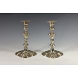 A closely matched pair of George II silver candlesticks, James and Mary Gould, London 1747, each