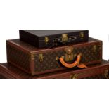 Louis Vuitton - a monogrammed coated canvas and leather hard suitcase, with monogrammed leather