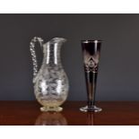 A Victorian wheel cut clear glass ewer, with hand cut decoration of floral sprays, fern fronds,