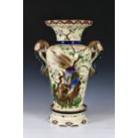 A large Victorian Majolica twin-handled floor standing vase, the Oriental inspired design with snake