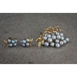 A vintage 14ct gold and cultured pearl brooch, of fruit and foliage design, with graduated grey