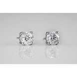 An impressive pair of 18ct white gold and diamond stud earrings, the diamonds totalling 2.62ct and