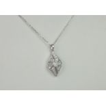An 18ct white gold and diamond pendant necklace, the pierced, lozenge form pendant set with a a
