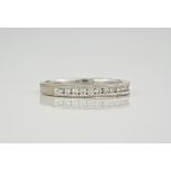 A platinum and diamond half eternity ring, the diamonds totalling 0.28ct and set with millegrain