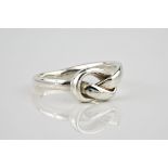 A 9ct white gold ring with knot detailing, Ring size P.