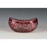 An antique cranberry cut glass centre piece or fruit bowl, of boat form, with cut fruit