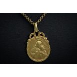 An antique French 18ct gold pendant, depicting Christ and a child, engraved monogram and dated '22