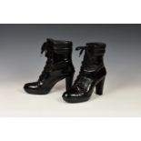 A pair of Tods ladies black leather short boots, with high heel, lace-up fastening, UK size 7.5,