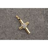 A small 18ct gold and diamond cross pendant, the diamonds forming a smaller cross over the yellow