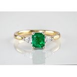 An 18ct yellow gold and 'no oil' emerald ring, the step cut emerald of deep, green colouring and