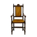 A 1920s oak open armchair in the 18th century style, the upright back with bobbin turned uprights