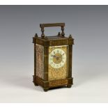 A French gilt brass single train carriage clock, c.1900, the fluted column case with floral and