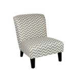 A modern easy chair, upholstered in grey and white zig-zag fabric, raised on dark stained square