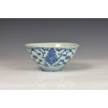 A Chinese blue and white porcelain Ming style bowl, probably 18th century, painted with flowers,