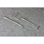 Two novelty silver 800 grade serving forks, fashioned as a garden fork and pitch fork, the largest