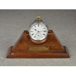 A pocket watch stand made from wood from the decking of the Mauretania, with gilt plaque, 2 3/