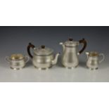 A George VI silver four piece tea service, Wakely & Wheeler, London, 1949, of tapering cylindrical