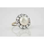 A mid-century 18ct gold, platinum, pearl and diamond cluster ring, 1920s-30s, the 10mm. bun-shaped