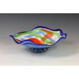 A vintage Stõlzle Oberglas multi-coloured glass centrepiece bowl, the footed bowl of organic form,