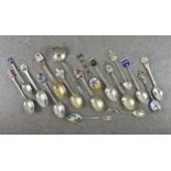 A small collection of silver and enamel souvenir spoons, comprising a Guernsey spoon by Kenneth