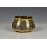 A Mamluk revival Damascus brass vessel, the vessel / bowl with slightly convex base, having silver