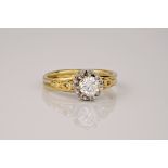 A vintage 18ct yellow gold and diamond solitaire ring, 1930s in design, the central stone held