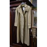 A ladies Burberry double breasted long trench coat, with Nova check lining, belt with leather