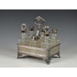 An elegant Victorian silver plate and cut glass cruet set, comprising of six various bottles sitting