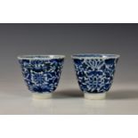 Two Chinese blue and white porcelain tea bowls, probably 18th century, both with six character mark,