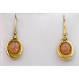 A pair of 18ct yellow gold, pink moonstone and diamond drop earrings., the cabochon moonstones a