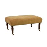 A rectangular upholstered footstool, to match lot 893, raised on reeded turned legs with brass