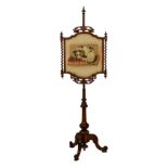 A Victorian rosewood pole screen with King Charles spaniel petit point, the shaped screen with