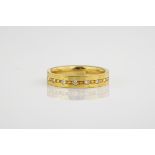 An 18ct yellow gold and diamond ring, half of the band studded with 7 diamonds totalling 0.25ct.