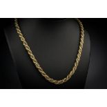 An 18ct two colour gold rope twist chain, 27½in. (70cm.) long.