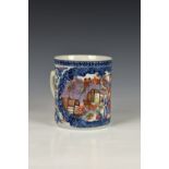 A 19th century Chinese famille rose tankard, polychrome enamel decorated with floral reserve of