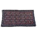 A Turkomen Taghan Ersari rug, the geometric tiled design in predominantly madder, brown, dark blue