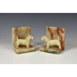 A pair of Art Deco alabaster cold painted cast West Highland Terrier bookends, each standing 4¾
