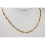 A 9ct gold three strand necklace, consisting of slender gold strands and balls.