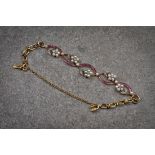 An antique 18ct gold, ruby, seed pearl and diamond bracelet, 1920s-30s, designed as a floral