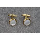 A pair of 9ct yellow gold and mother of pearl cufflinks, the mother of pearl of bright white