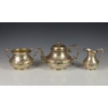 A Victorian three piece tea service, Robert Harper, London, 1859, comprising of teapot, milk jug,