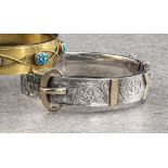 An antique 9ct gold and silver hinged bangle, with chased foliate decoration and 9ct buckle;