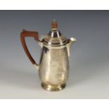 A George V silver coffee pot, William Greenwood & Sons, Birmingham, 1930, of circular bellied and