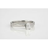 A platinum and emerald cut diamond solitaire ring, the diamond totalling 0.33ct, ring size L.